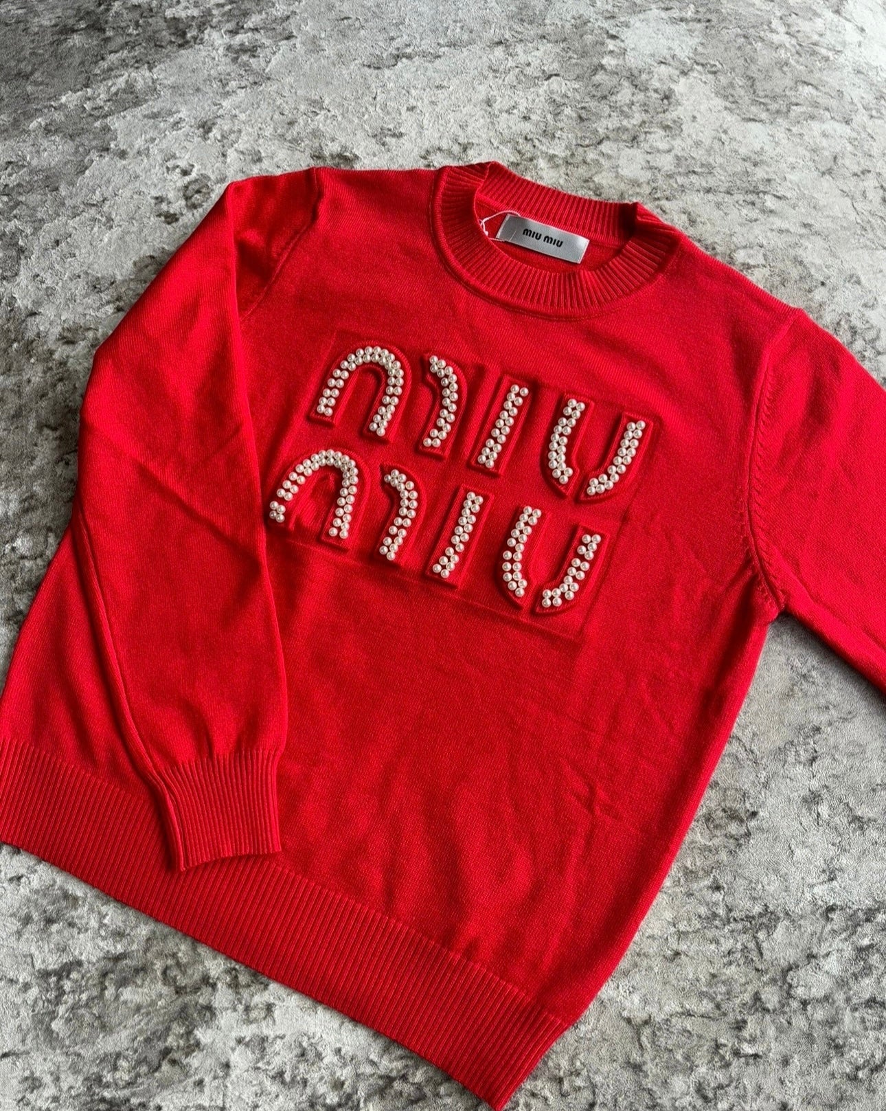 Red pearl jumper in stock