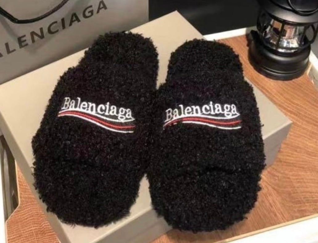 Black slippers in stock